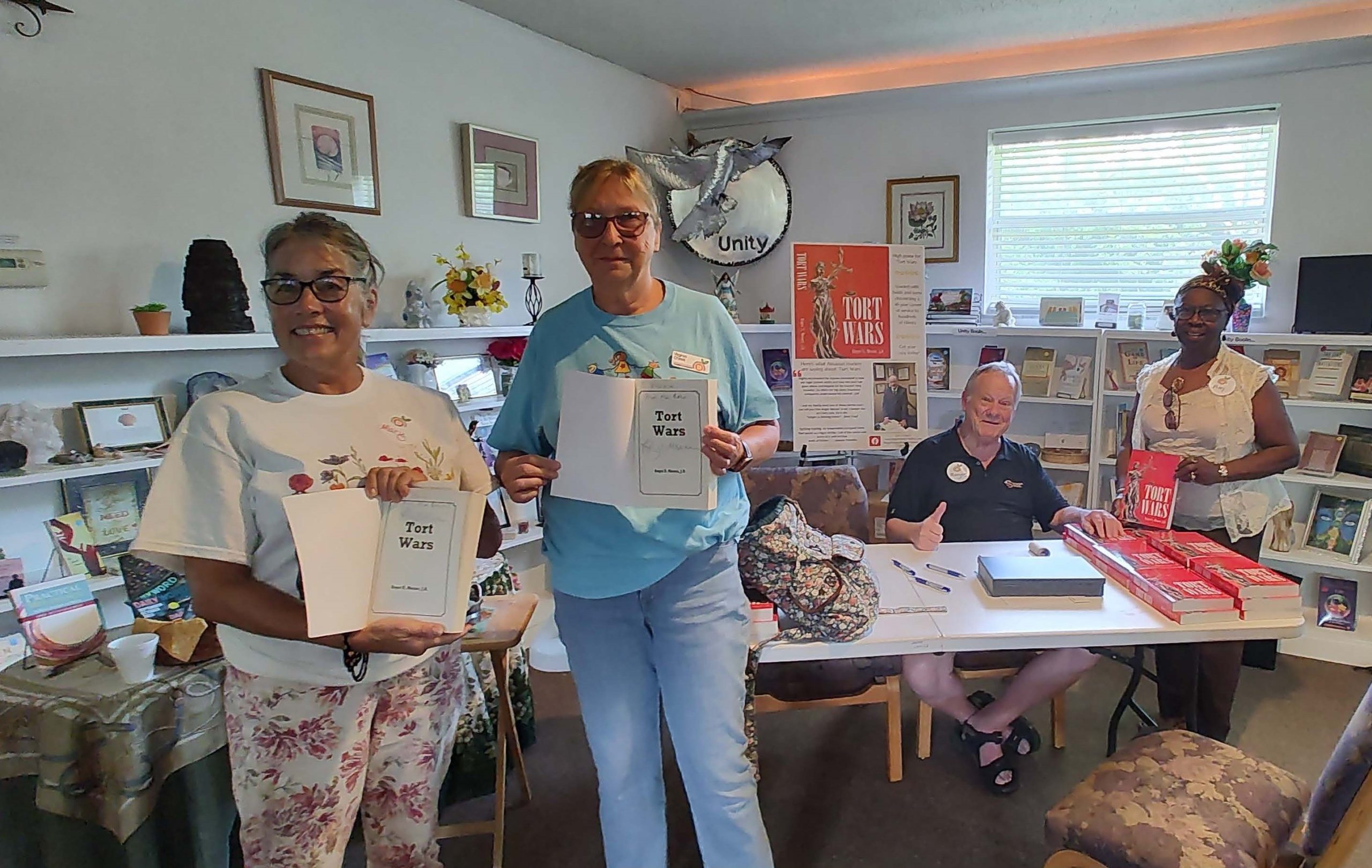 Roger Signing Book for Mary Sirmons while 2 Other Members Wait for Their Books to be Signed