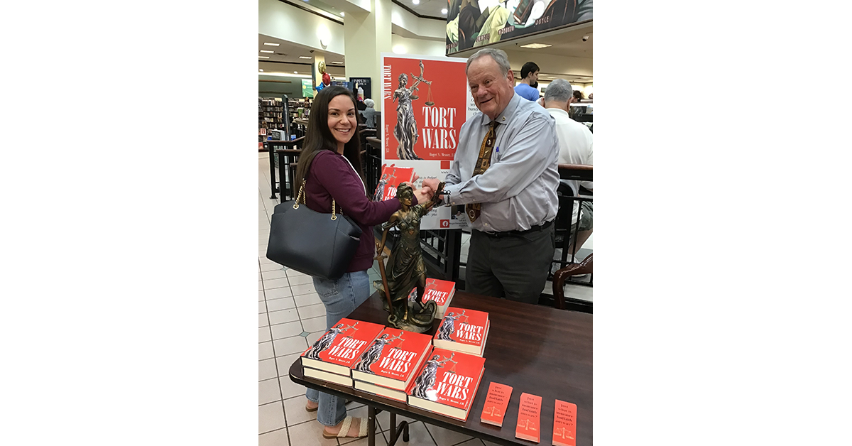 An image at a Book signing or Roger N. Messer J.D
