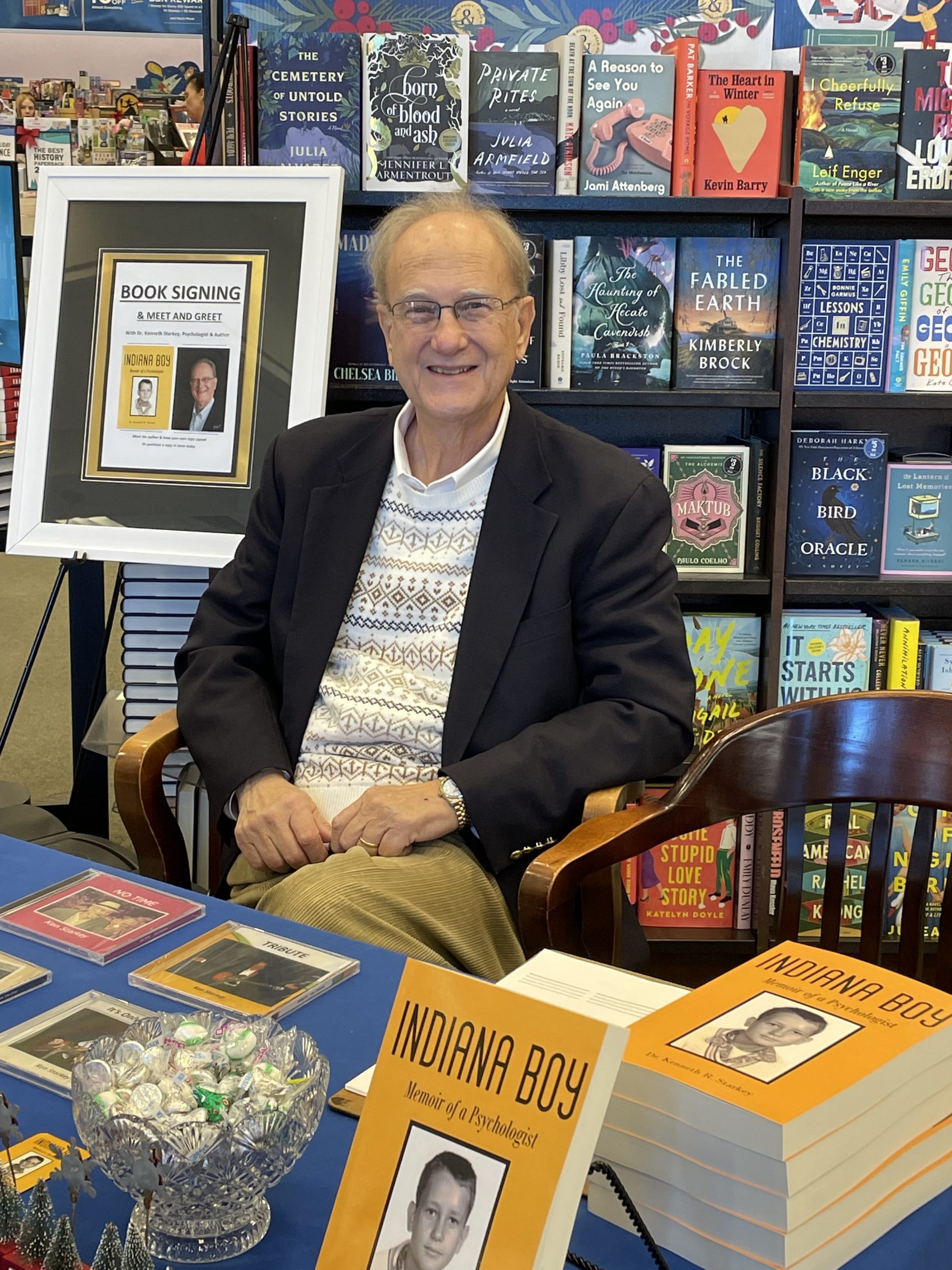 Photo of Ali Mazhin holding his book, The Running Journey