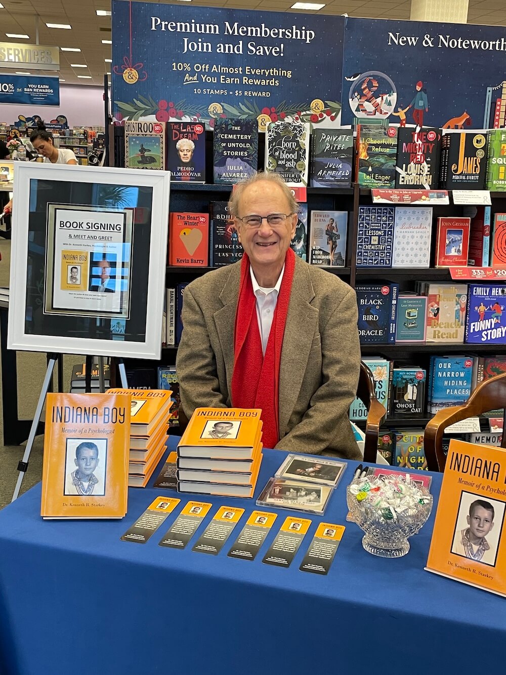 Photo of Ali Mazhin holding his book, The Running Journey