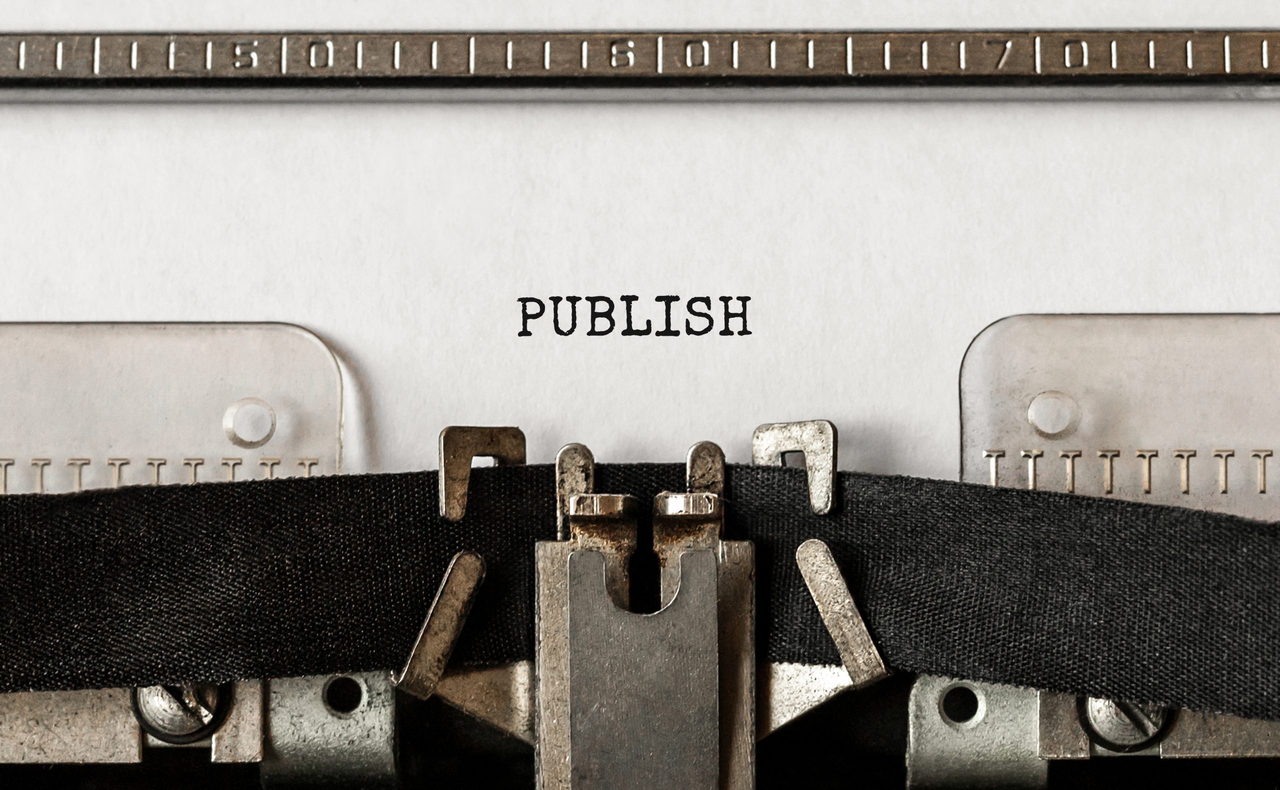 Text Publish typed on retro typewriter The word "Publish" typed on retro typewriter