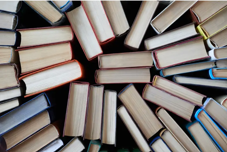 tops of books standing up and in a spiral