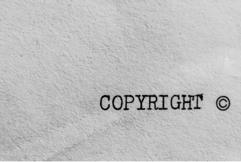 typewritten word “copyright” isolated on a white paper page
